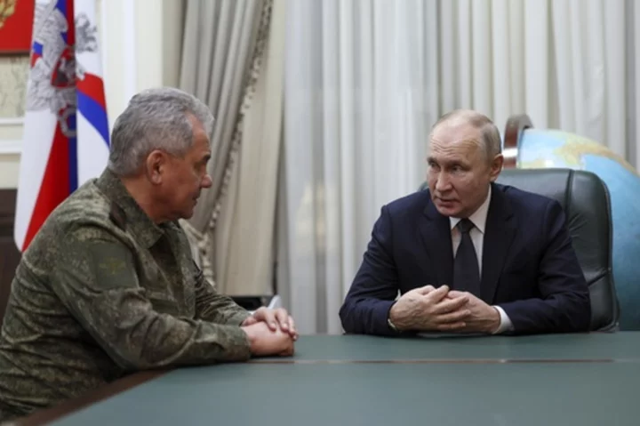 Putin and top military leaders visit southern military headquarters to assess his war in Ukraine