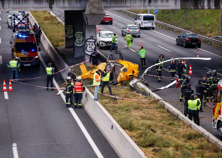 Helicopter crashes onto busy Madrid motorway and hits car