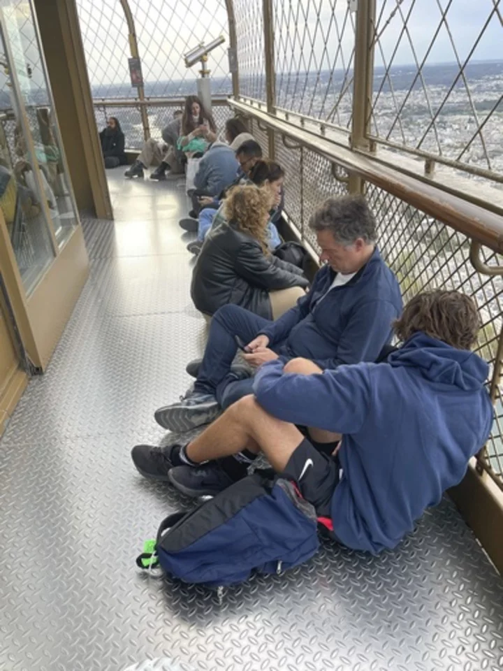 Stranded on the Eiffel Tower, a couple decide to wed, with an AP reporter there to tell the story