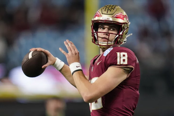 Tate Rodemaker throws warmup passes for Florida State ahead of ACC title game